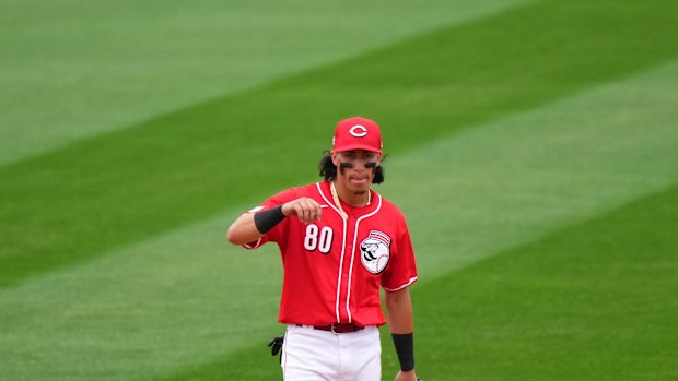 Cincinnati Reds shortstop Edwin Arroyo (80) gets set for a pitch in the eighth inning during a MLB spring training baseball game, Monday, Feb. 26, 2024, at Goodyear Ballpark in Goodyear, Ariz.  